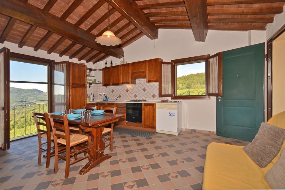 The living/dining room with sofa bed and kitchenette