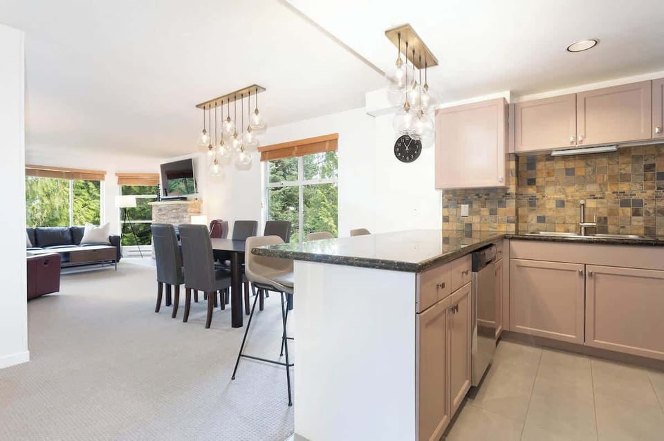 - Open-concept kitchen and dining area perfect for shared gatherings  
- Modern lighting and sleek finishes create a warm inviting flow  
- Ideal setup for family meals or group get-togethers after mountain fun  
