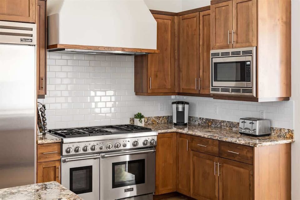 Luxury appliances and fully stocked cabinets