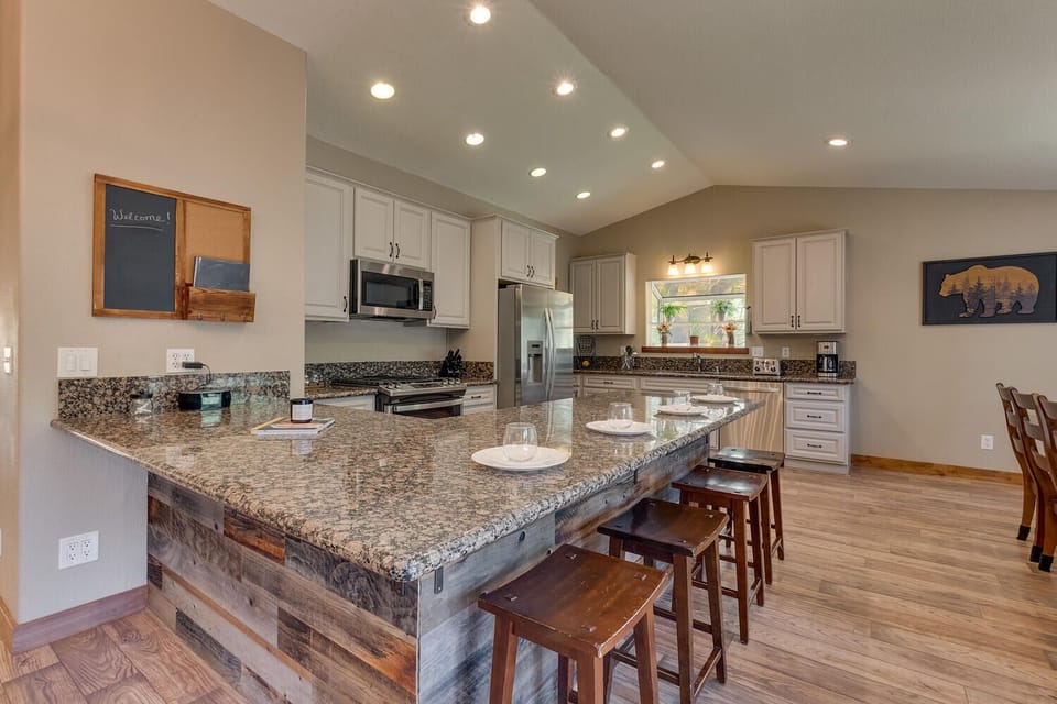 - Spacious kitchen with granite counters and bar seating  
- Stainless steel appliances for cooking convenience  
- Perfect for family meals in your Tahoe vacation home
