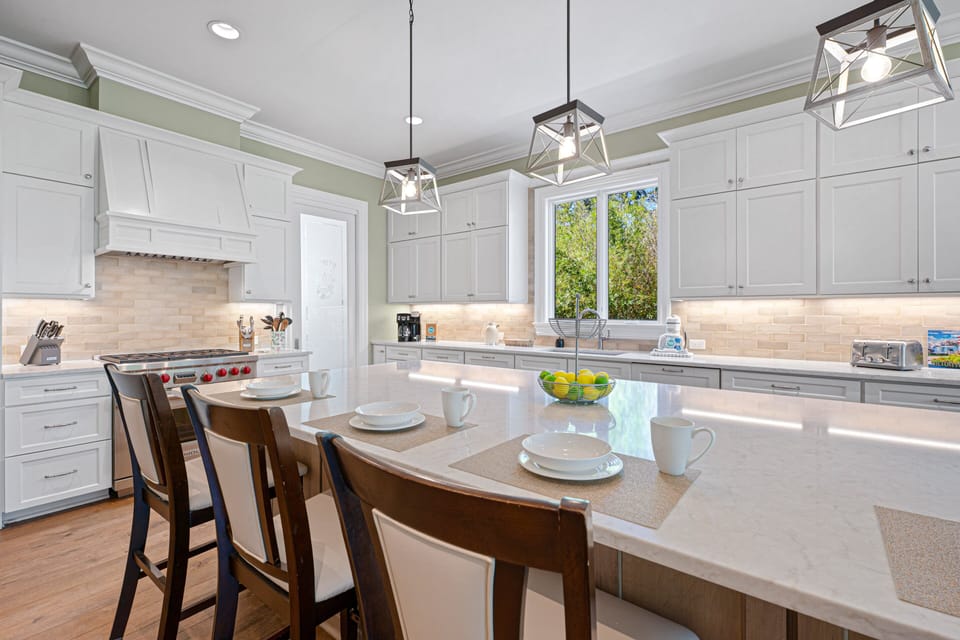 Thoughtful details like the built-in beverage cooler, professional-grade range, and spacious work areas make meal preparation effortless.