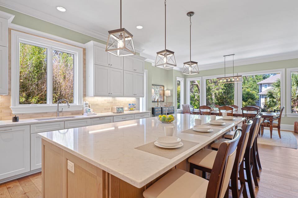 The open layout keeps cooks connected to family and friends throughout the adjoining living and dining spaces.