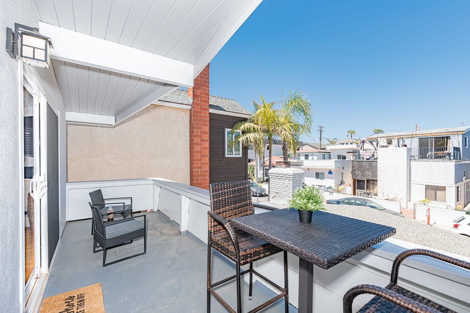 The front patio includes seating for four and a propane BBQ grill for sunset cookouts.
                
