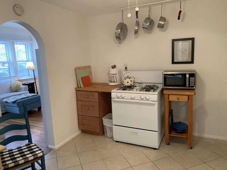 Gas stove and Kate Spade tea pot.