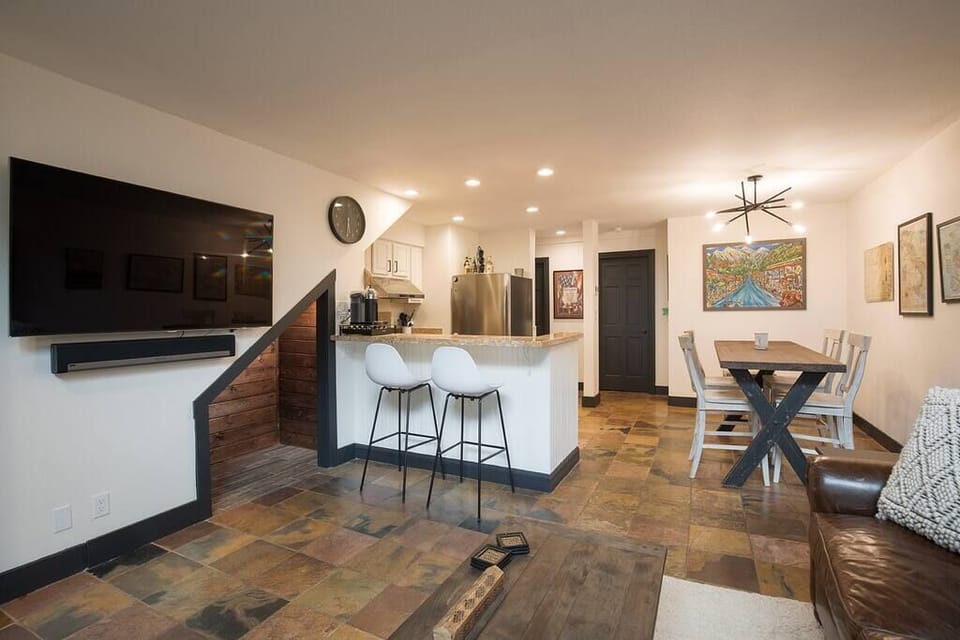 Bar seating and a large dining room table