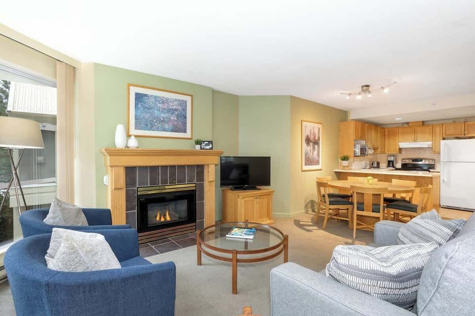 - Cozy Whistler condo with fireplace and modern alpine charm  
- Open living space perfect for relaxing after skiing adventures  
- Mountain retreat steps from slopes and Whistler village fun  
