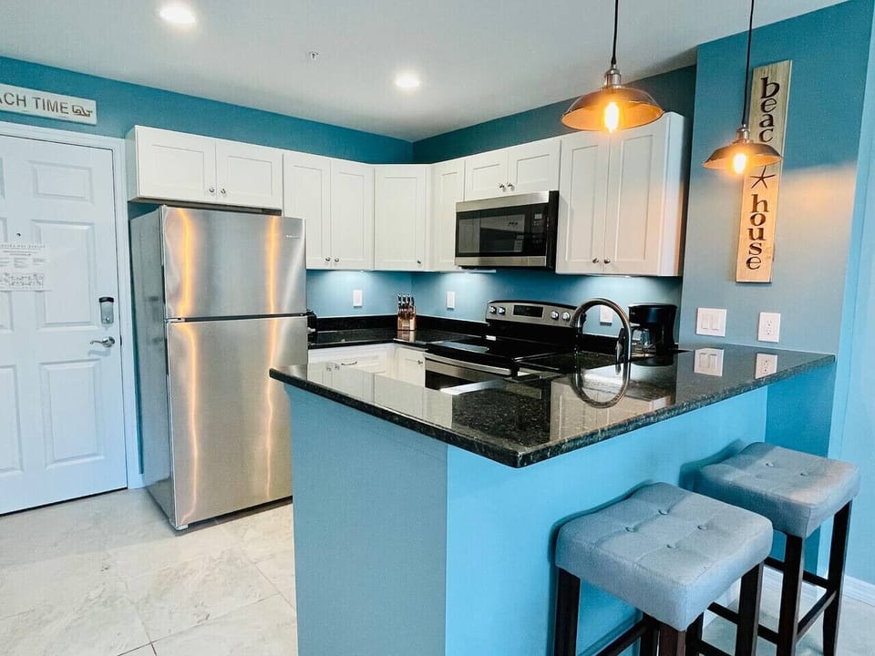 Granite kitchen with bar seating, ready for beach-day breakfasts