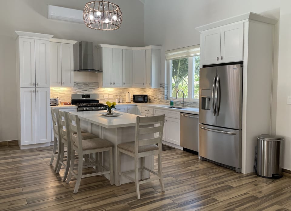 Fully stocked Kitchen with Island seating for four