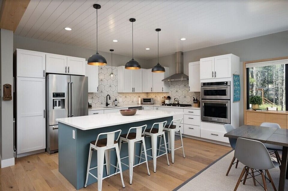 Beautiful well equipped kitchen with stainless steel appliances and gas range