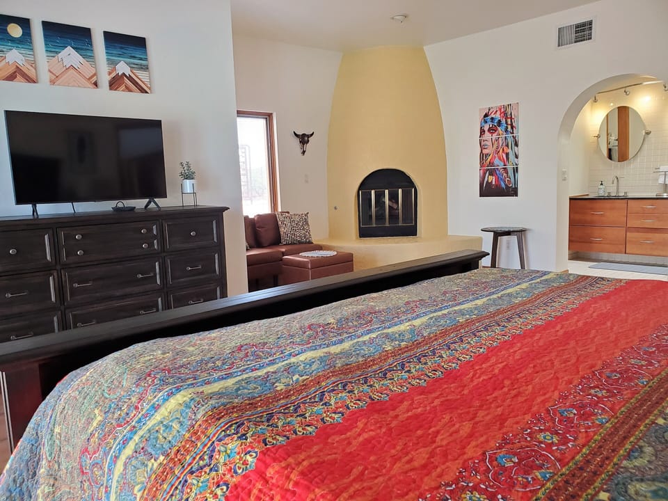 Master Bed with sitting area & Beehive Fireplace