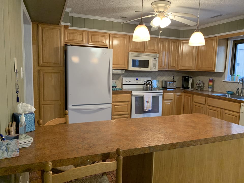 Spacious kitchen with coffee maker, keurig, counter seating