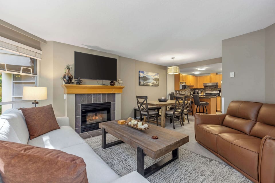 - Inviting living and dining area with ski-themed décor  
- Soft seating and warm lighting for cozy evenings  
- Direct balcony access to enjoy forest-fresh air  