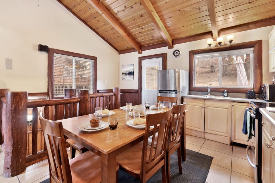 Fully equipped cabin kitchen with ample cabinetry, stove, fridge, microwave, and coffee maker—perfect for cooking meals, morning coffee, and feeling right at home on your stay.