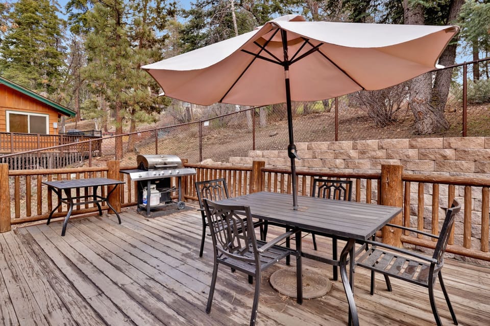 Private outdoor hot tub, surrounded by tall pines, perfect for relaxing under the trees after a day of adventure—enjoy peaceful forest views, fresh air, and a truly rejuvenating stay.