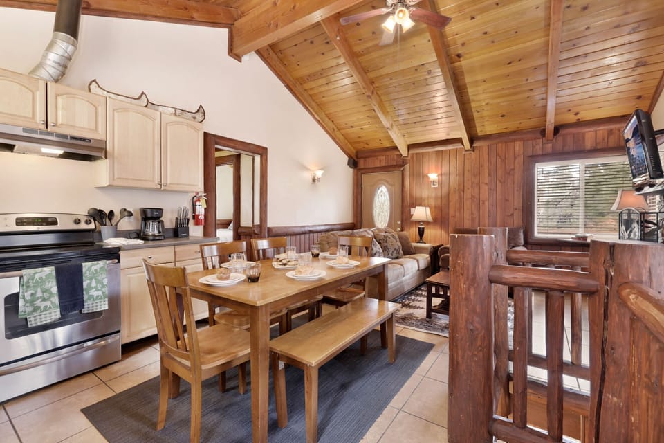 Fully equipped cabin kitchen with ample cabinetry, stove, fridge, microwave, and coffee maker—perfect for cooking meals, morning coffee, and feeling right at home on your stay.