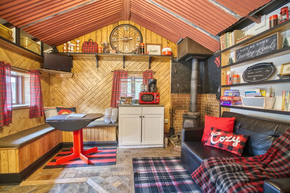 Charming banquette seating is perfect for dining in, board games, or a remote work space with mountain views.