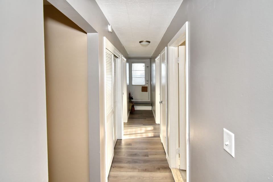 Hallway to bedrooms and bathroom