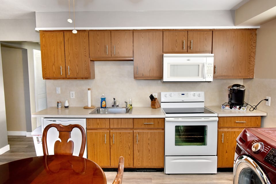 Kitchen features range, oven, microwave, dishwasher, refrigerator, Keurig