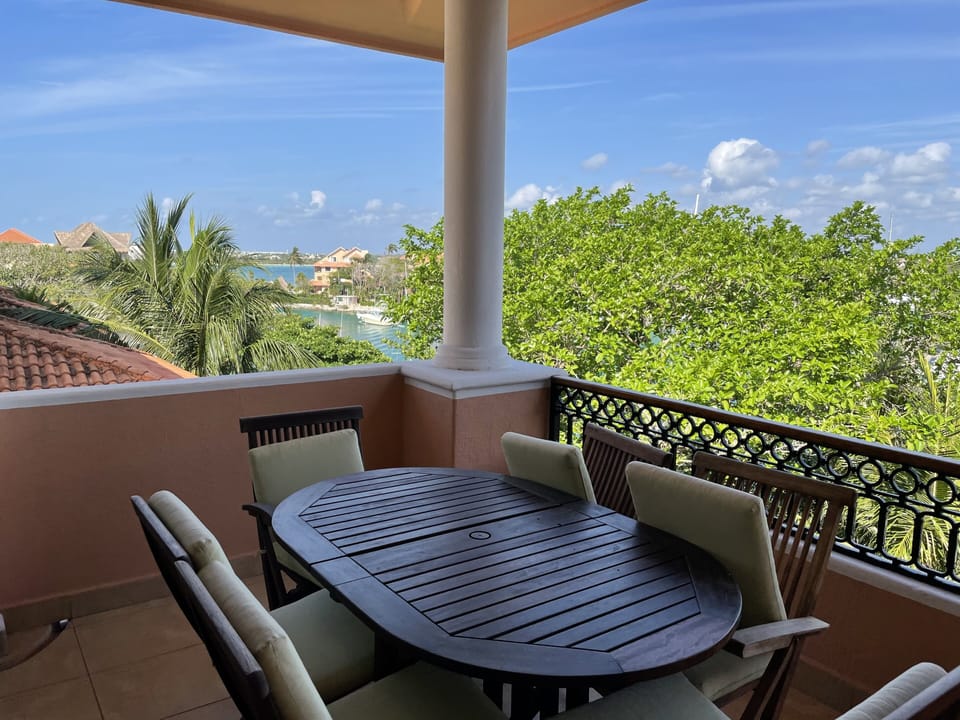 Balcony has table seating for 6 and two chaise lounges