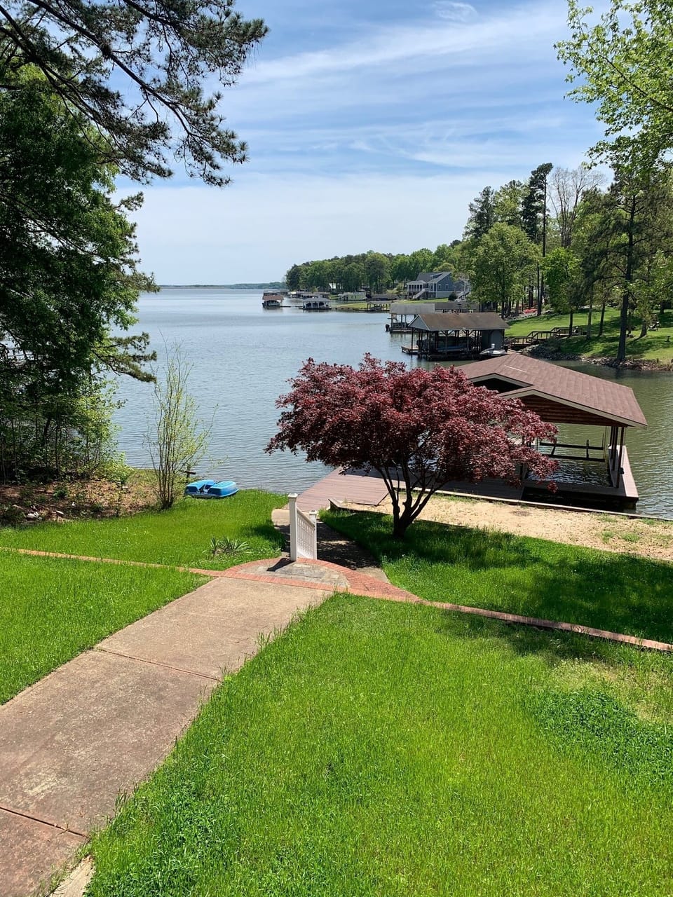 Lush tiered yard for playing games while over looking Jimmy's Creek