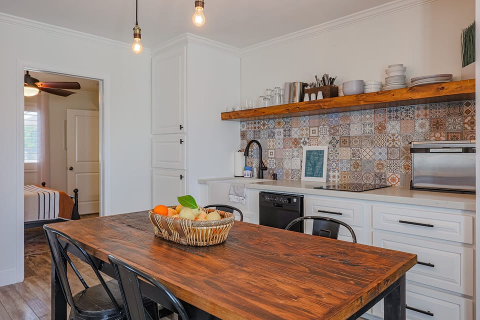 Microwave and a washer/dryer combo unit are located in the pantry