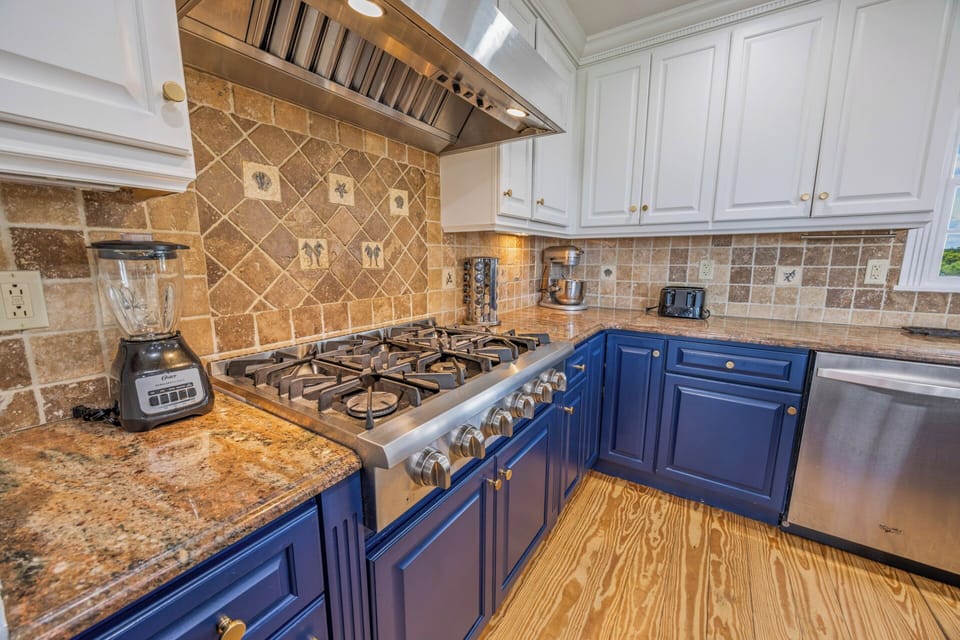 Gourmet Chef's Kitchen with Granite Countertops, Dual Refrigerators & Modern Appliances — Perfect for Group Meals | Luxury Outer Banks Beach House