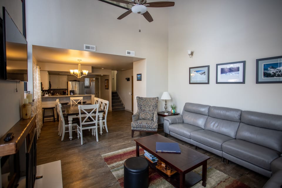 Spacious living room with large sectional and tv