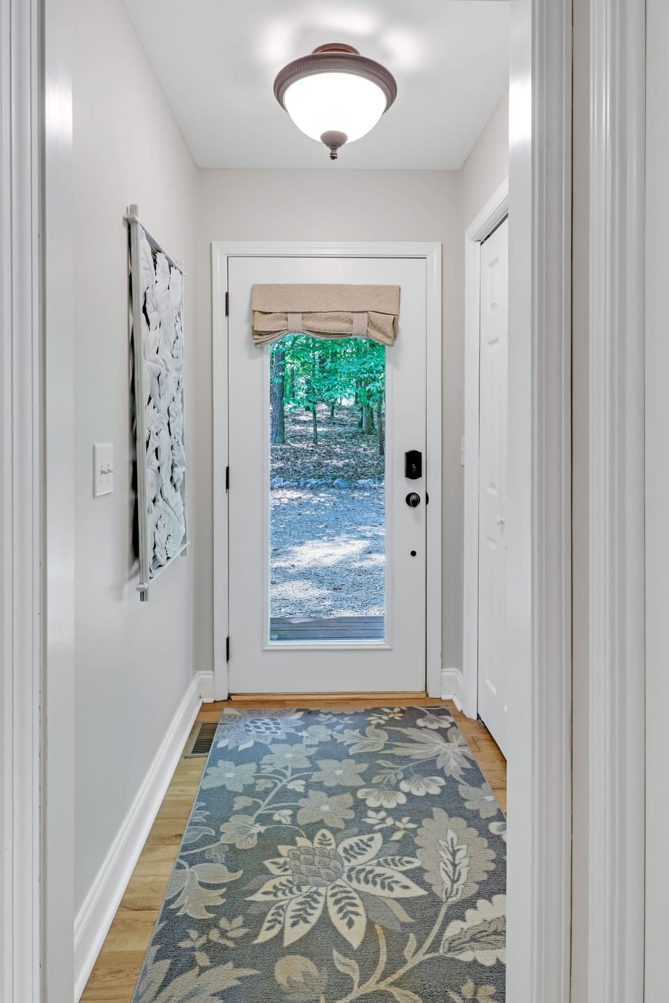 Front door entry with view of parking directly in front of home. 