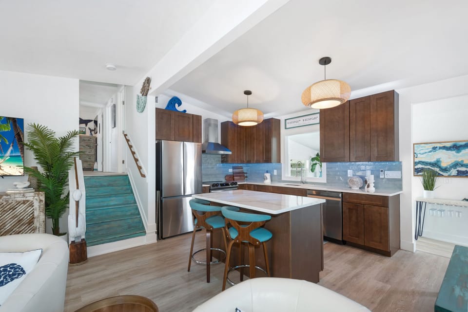 Living room into kitchen and stairs to the bedrooms