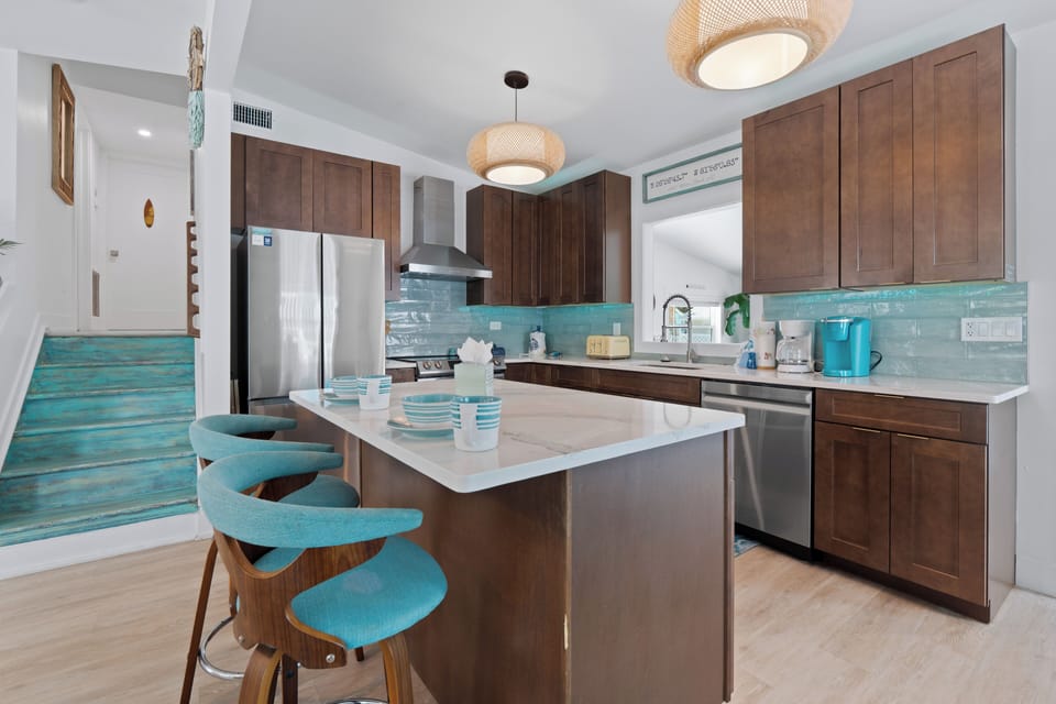 Two barstools on a spacious island.