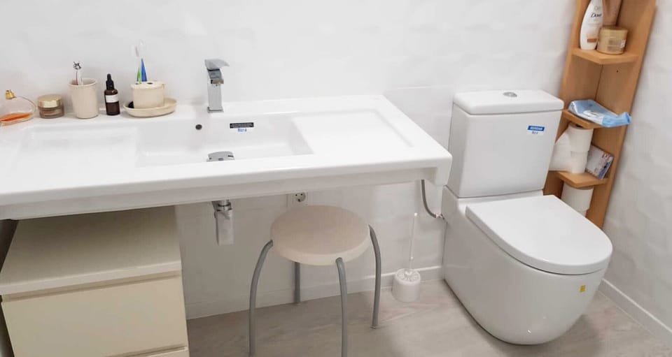 Cozy bathroom with toilet and sink