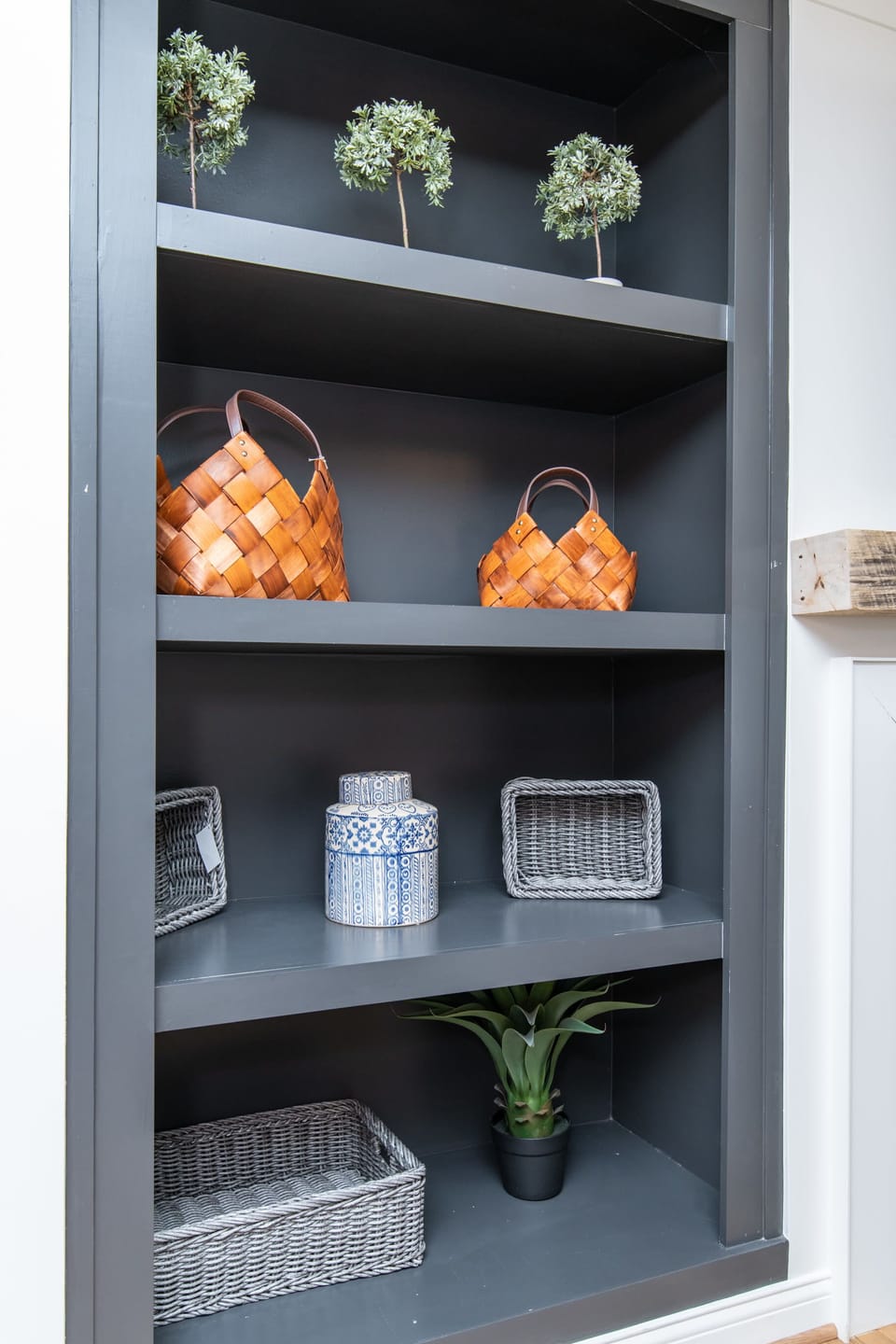 Beautifully decorated shelf in the living room, adding charm and character to the space with thoughtful accents and a warm, welcoming touch.