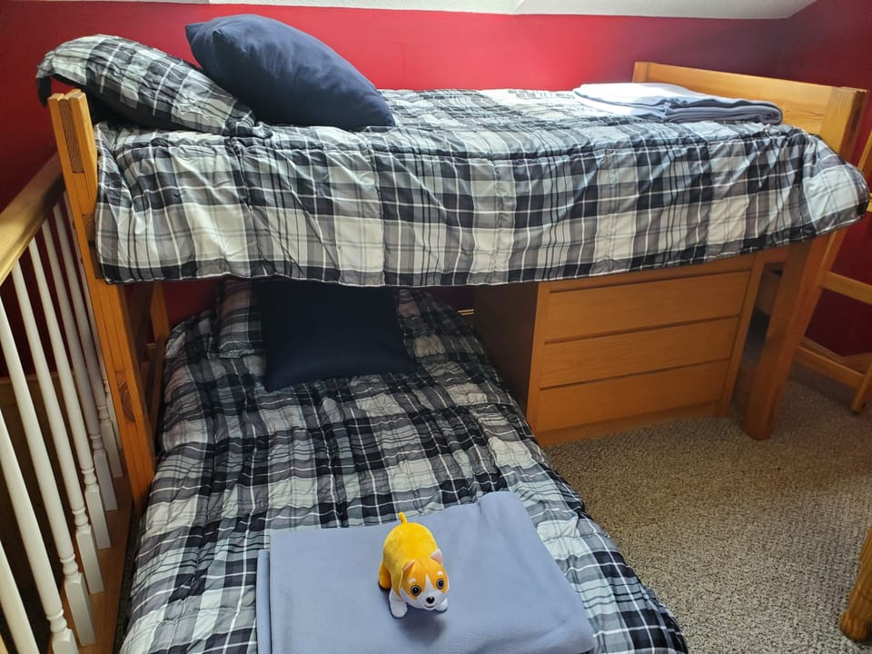 Loft bedroom with 4 twin beds, A/C, and cable TV