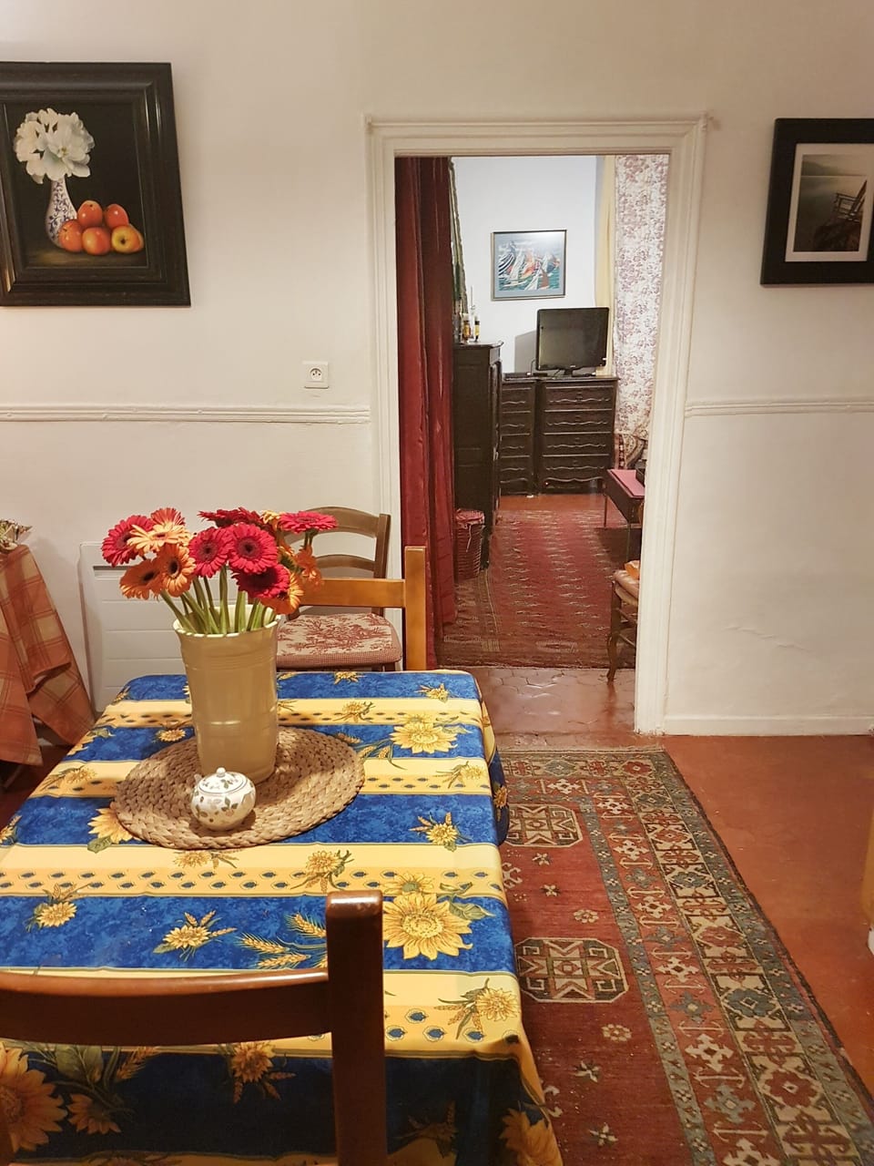 The table expands to hold six, lots of tablecloths, silverware, dishes, glasses