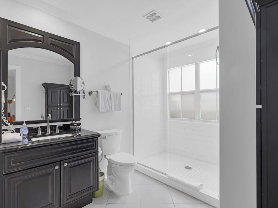 First floor ensuite bath with spacious walk-in glass shower.