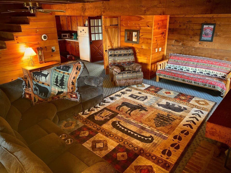 Welcome to your large, oh-so-comfy living room. Have a seat...there's plenty of room for everyone on the overstuffed
recliner, sectional with 3 recliners, and futon bed, which accommodates an extra set of sleepy eyes.