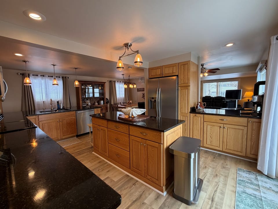 Kitchen with granite counter tops and large island