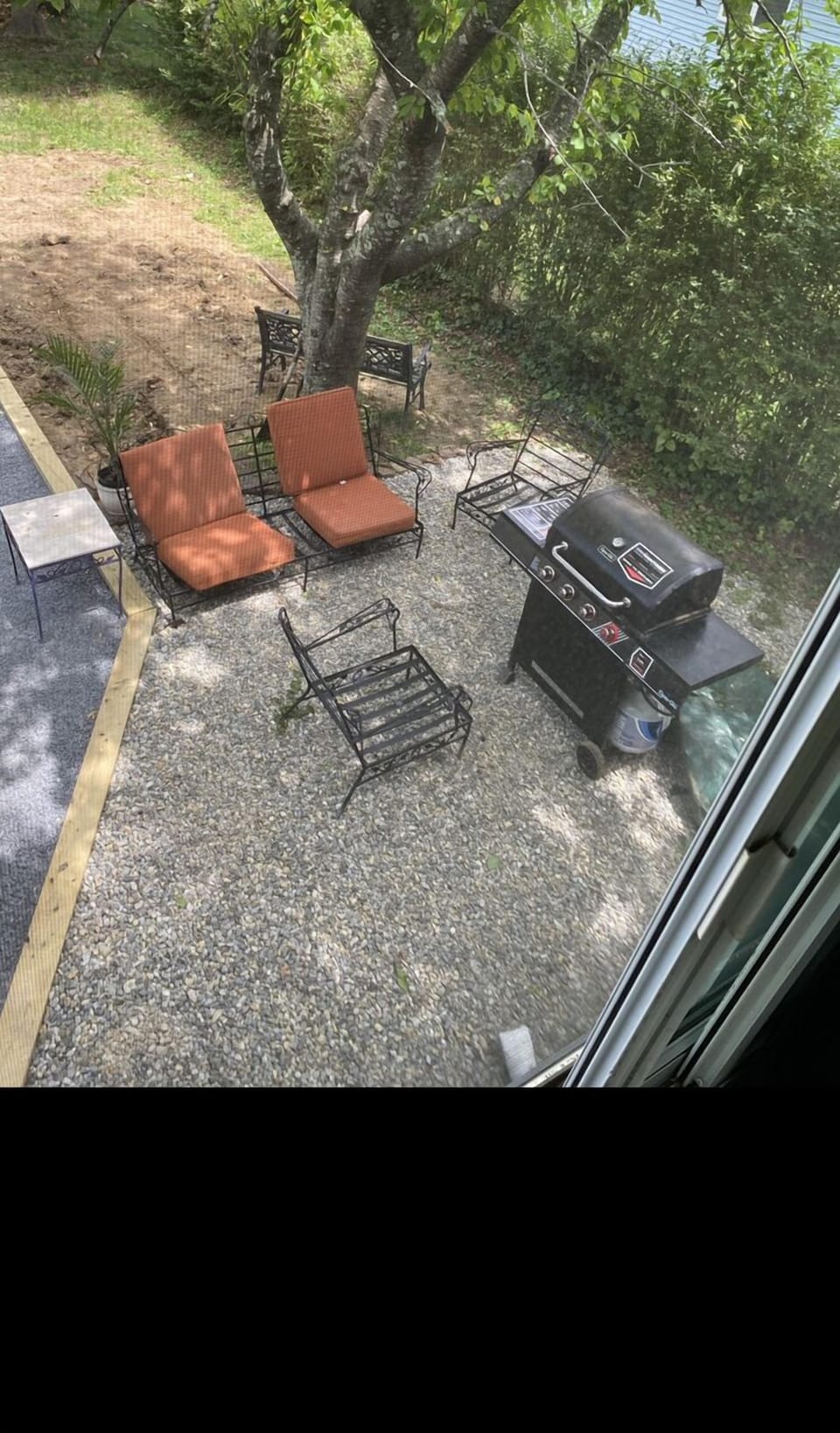 Private outdoor patio set up with new grill!