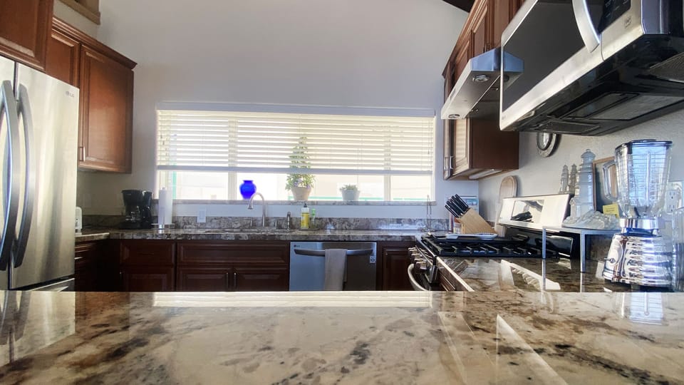 Kitchen fully equipped for dining-in with utensils, pots, pans, glasses & more!