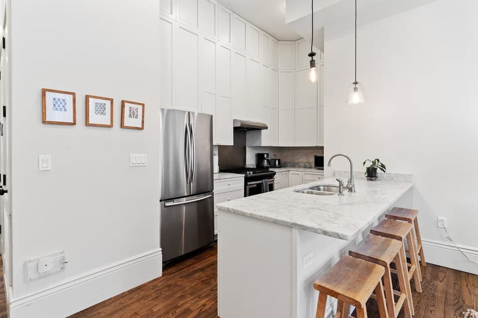 Kitchen area with additional bar seating 
