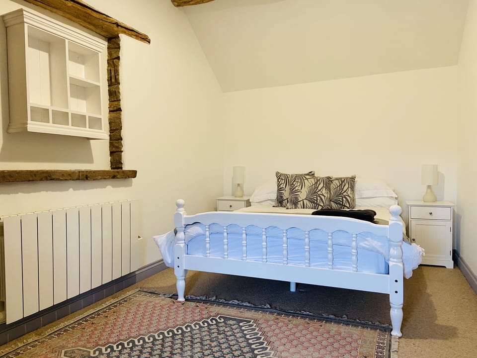 Bedroom 1 with large double bed, beautiful countryside views and wardrobe.