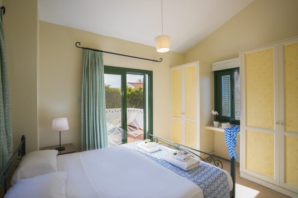 Bedroom 3 with double bed fitted wardrobes, bedside cabinets and patio doors