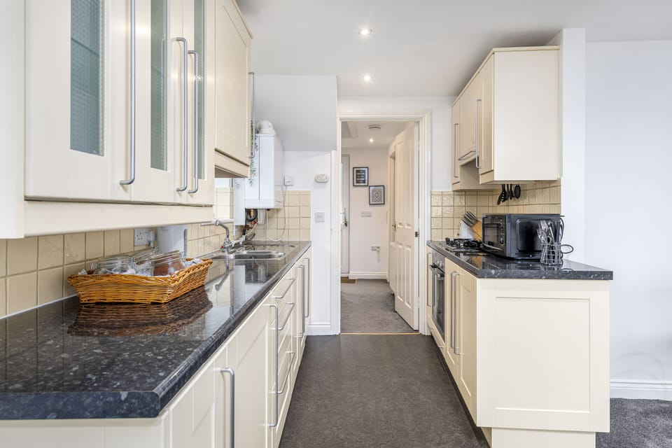 Kitchen Leading to Entrance Hall and Bedroom