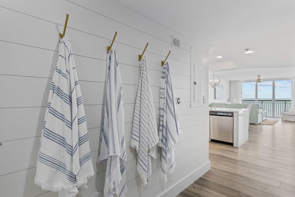 Hooks for beach towels and purses in the hallway