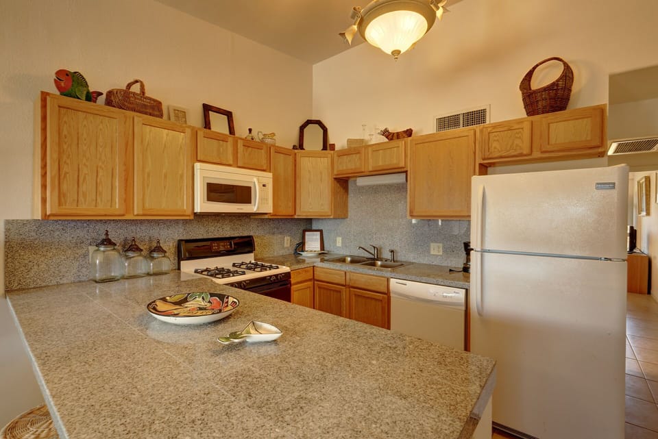 Large counter top with several bar stools for that quick snack!