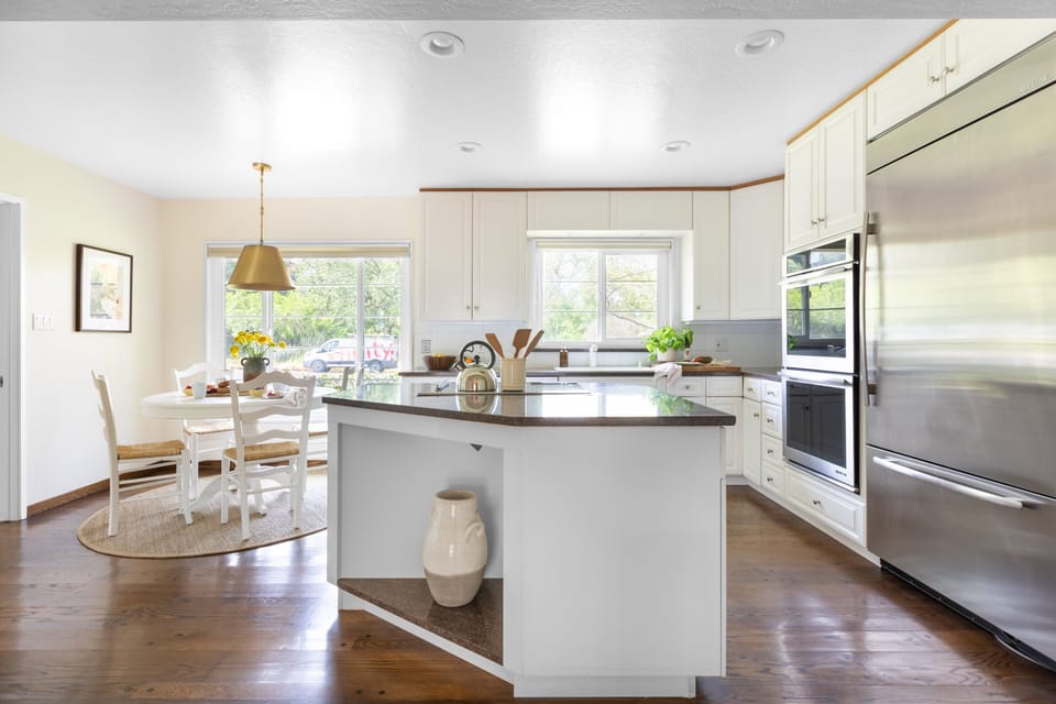 Kitchen features an island and modern appliances.