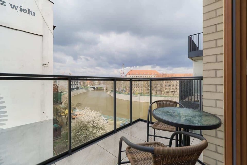 The balcony's stylish design complements the apartment's decor. 