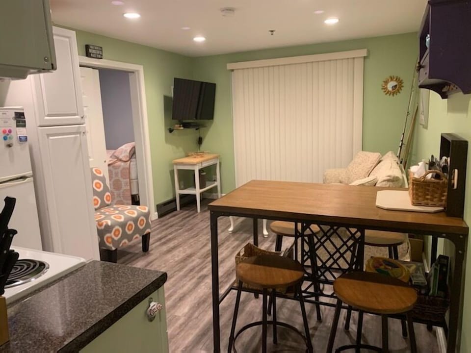 Living space opposite the kitchen area complete with flat screen tv and pull out sleeper sofa.