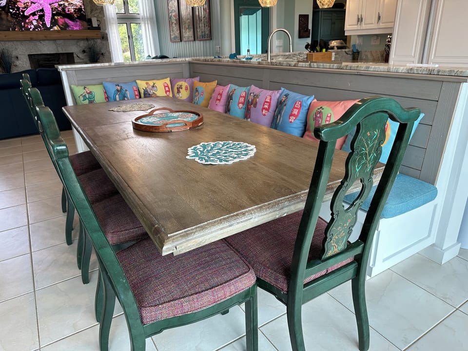 Kitchen Bar Adjacent to Dining Table Seats Additional Five Guests. 