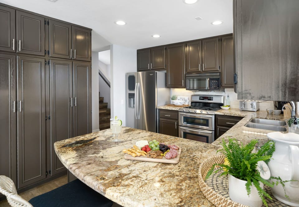 The spacious kitchen has ample storage and entertaining space.
